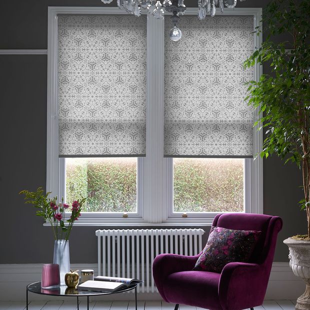 Traditional chic living room with sash windows dressed with grey roller blinds