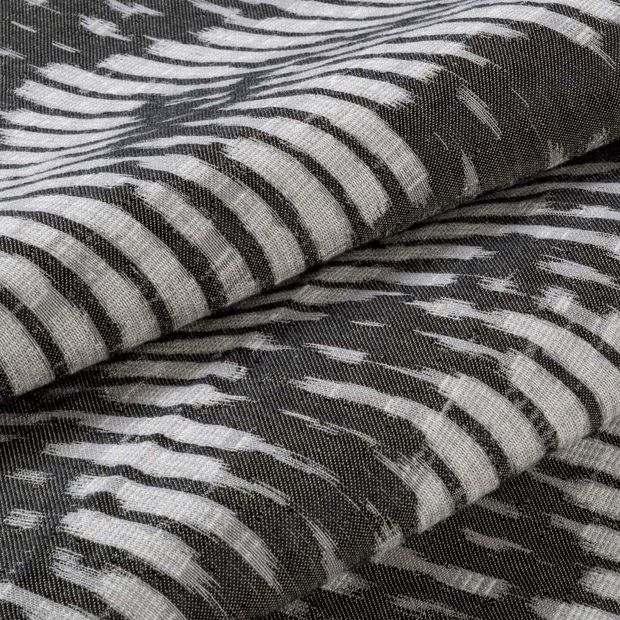 Black and white striped Cadillac Noir swatch on a ream of fabric