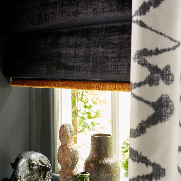 Close up of Abigail Ahern dark grey roman blinds