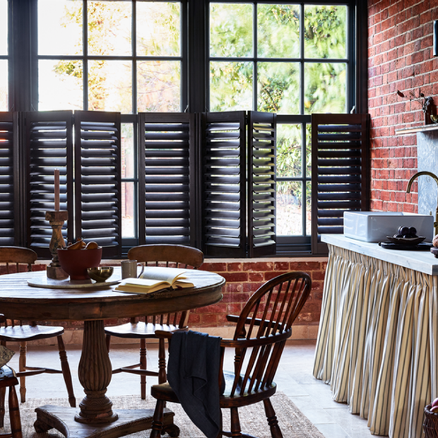 Grey cafe-style shutters in kitchen