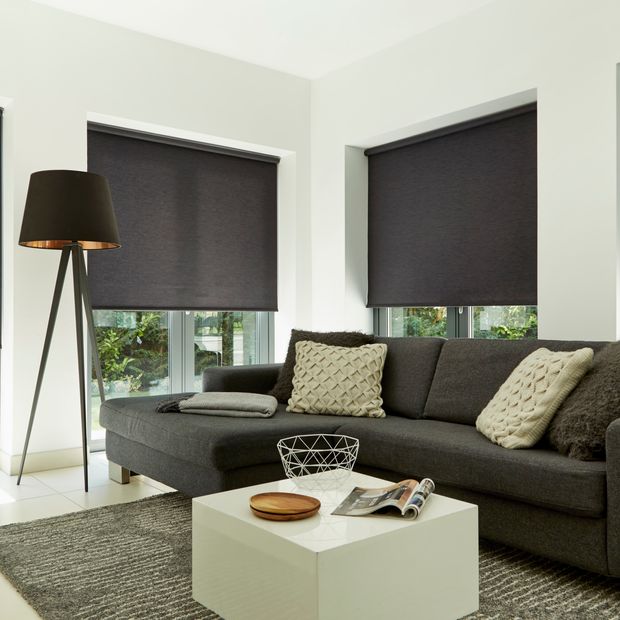 Plain dark Norfolk Charcoal roller blind hung in living room