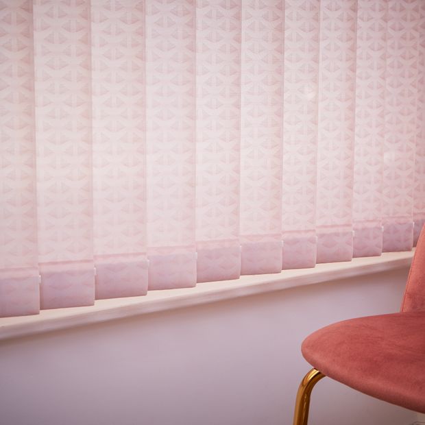 Close up of light pink vertical blinds
