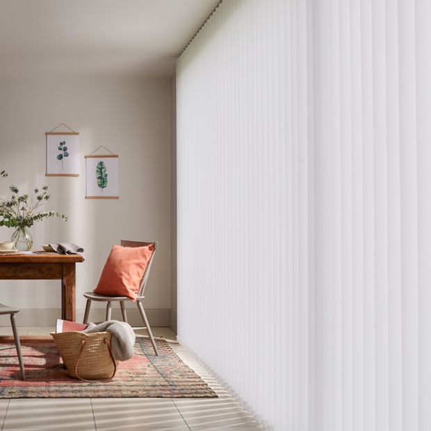 Modern rustic dining room with full length white vertical blinds