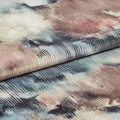 afolded fabric of aurora moonlight with a repeating watercolour style in black, pink and white