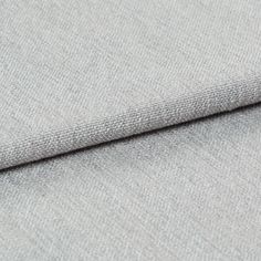 Light grey coloured fabric that has been folded over to display the material