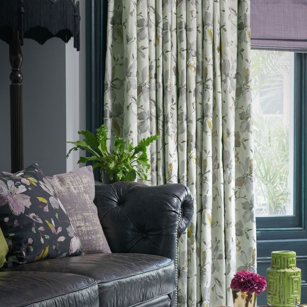Close up of Forenza Sterling curtains Clarence Mauve romans in living room