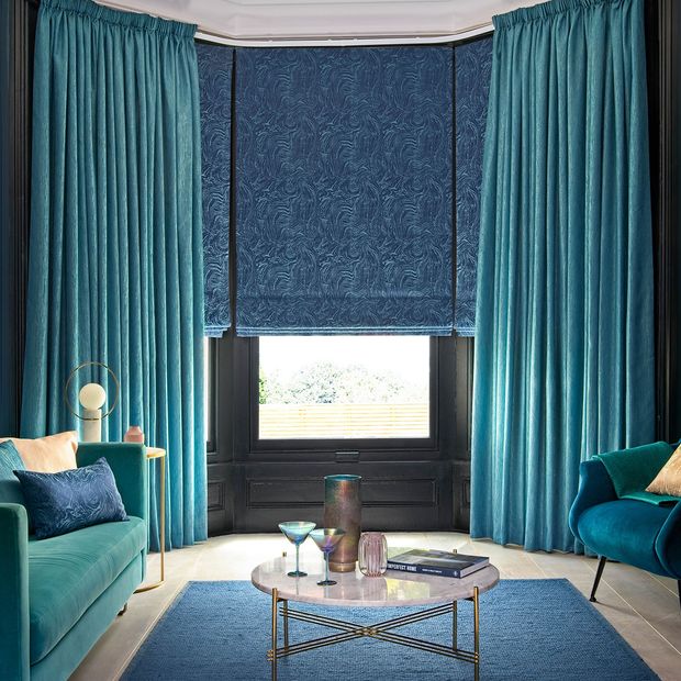 Close up of Surface Peacock curtains and Muse Deep Lapis romans in living room
