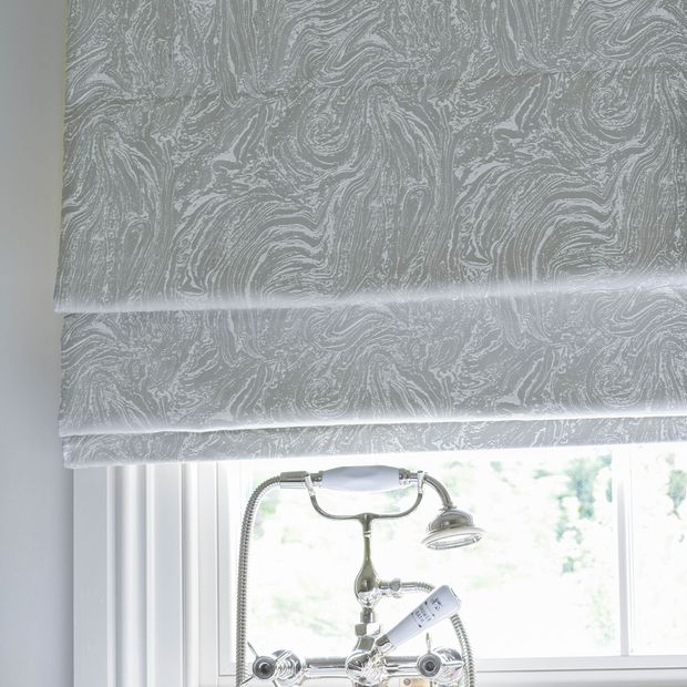 Close up of Siver marble effect Roman blinds in a bathroom