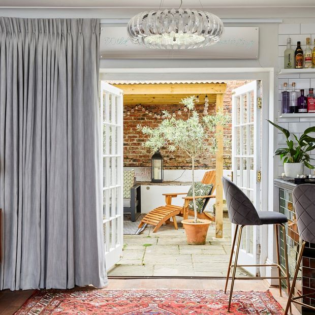 A bar space with patio doors leading outside