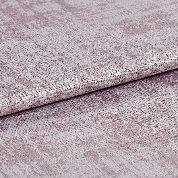 Folded fabric in a shimmering and textured purple colour