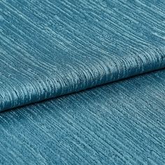 Teal Blue material with a shining quality and repeating textured pattern