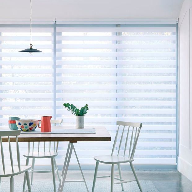 A white day and night blind in a kitchen with a table