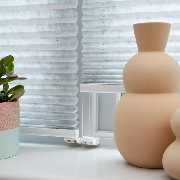 Close up of grey Pleated blinds.