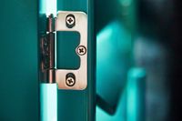 Close up image of coloured hinges on custom coloured wooden shutters