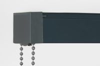 close up of a black head rail for vertical blinds