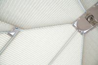 multiple cream pleated blinds in different shapes on conservatory roof