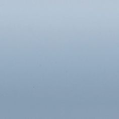 A swatch showing the Spectrum Seablue Venetian blind swatch in its blue-grey tone
