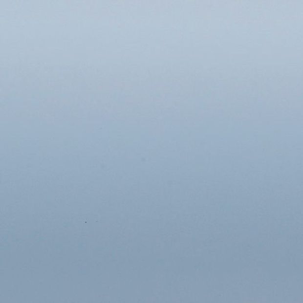 A swatch showing the Spectrum Seablue Venetian blind swatch in its blue-grey tone