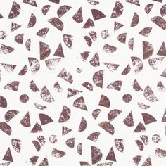 White coloured roller fabric with repeating oval and triangular shapes in a brown colour with a weathered texture