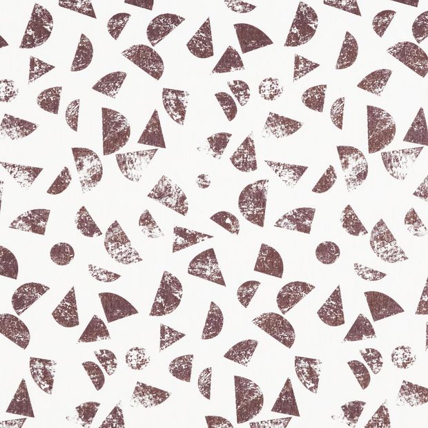 White coloured roller fabric with repeating oval and triangular shapes in a brown colour with a weathered texture