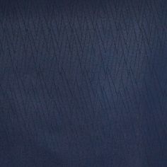 Prism Navy swatch features a pattern of dark zigzag prism shapes on a dark navy backdrop