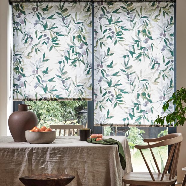 Rio juniper roller blind in large kitchen window with rustic style furniture