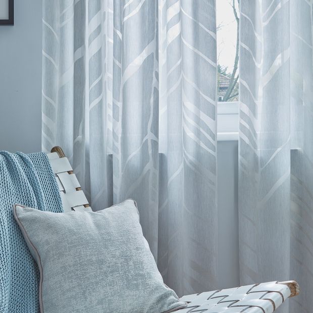 Close up shot of alpine silver patterned voile curtains