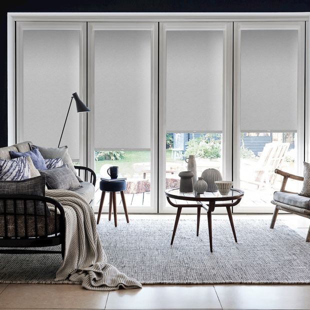 Marco Cinder grey perfect fit roller blind in patio door frame with contemporary furniture and grey accessories