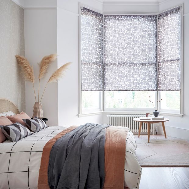 Mathcsticks mono roller blinds in a bedroom window