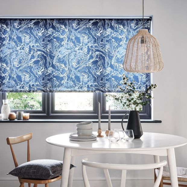 Marble Aquamarine Roller Blind in a dining room with a table and chairs