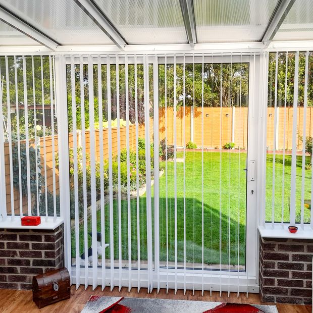 acacia white vertical blinds in conservatory