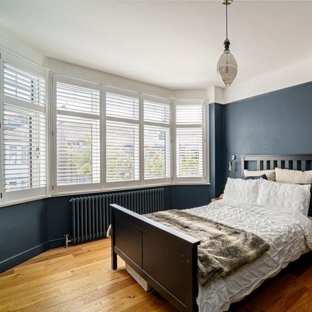 Silk white shutters in bedroom