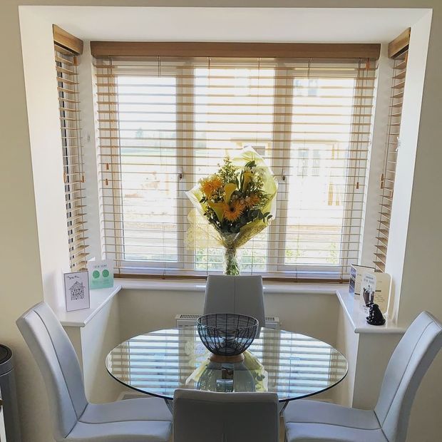 Ellwood light oak wooden blinds in box window in living room