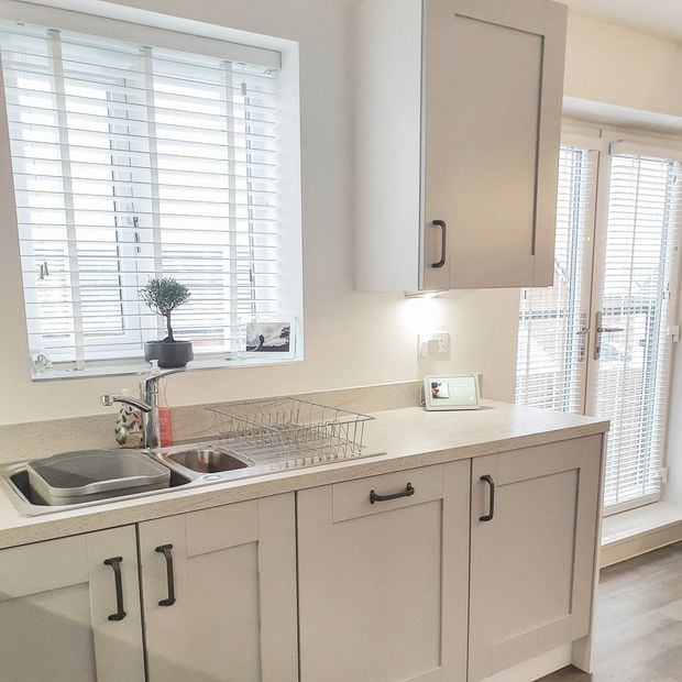 Mirage chalk white faux wood venetian blinds in kitchen