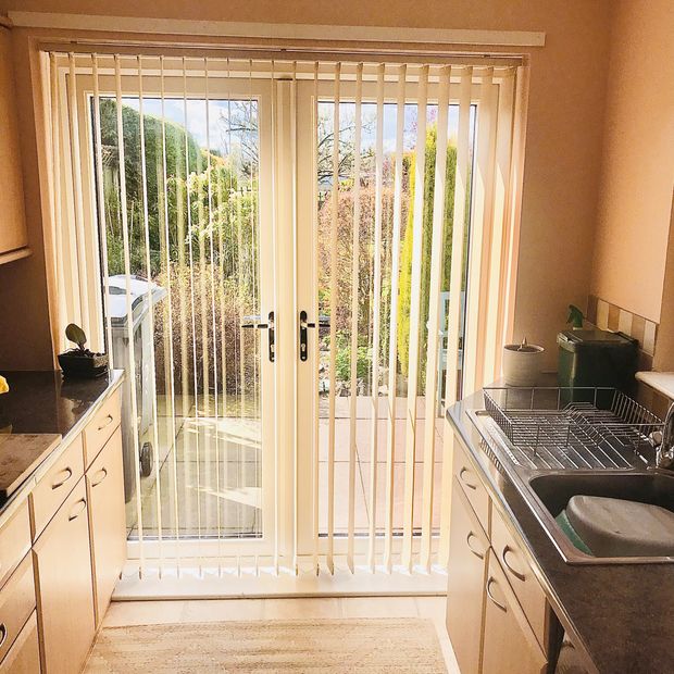 Florence beige vertical blinds on kitchen patio door