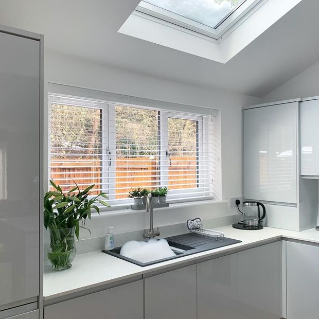 Illusions Matt white faux wood venetian blind in kitchen