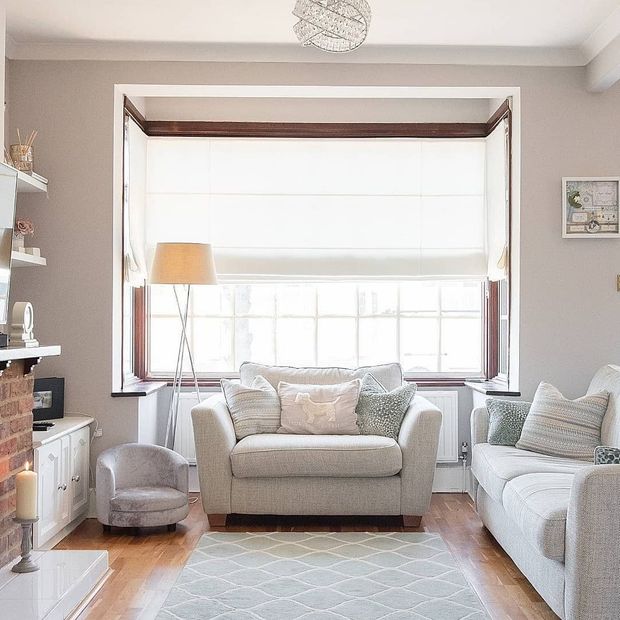 Ozone cream voile roman blinds in box window