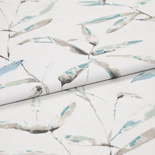 A folded piece of fabric with Aloha Turquoise Teal printed on it
