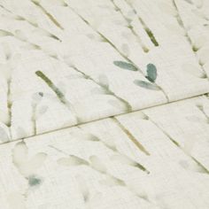 A folded piece of fabric with Amerlia Mineral Blue printed on it