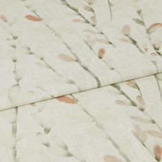 A folded piece of fabric with Amerlia Pomegranate Orange printed on it