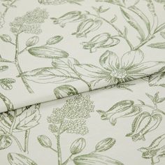 A folded piece of fabric with Anika Green printed on it