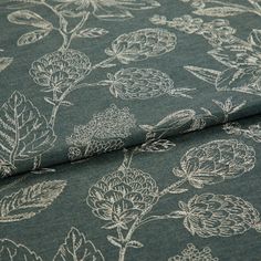 A folded piece of fabric with Anika Grey printed on it