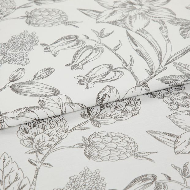 A folded piece of fabric with Anika Silver printed on it