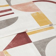 A folded piece of fabric with Block Terracotta Red printed on it