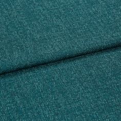 A folded piece of fabric with Boheme Teal printed on it