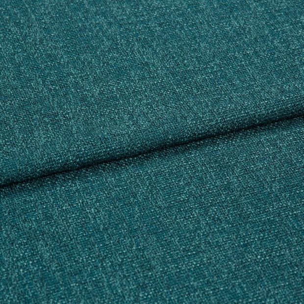 A folded piece of fabric with Boheme Teal printed on it