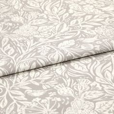 A folded piece of fabric with Aida Lilac printed on it