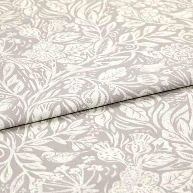 A folded piece of fabric with Aida Lilac printed on it