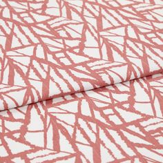 A folded piece of fabric with Alder Red printed on it