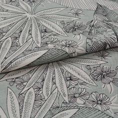 A folded piece of fabric with Diva Mineral Grey printed on it